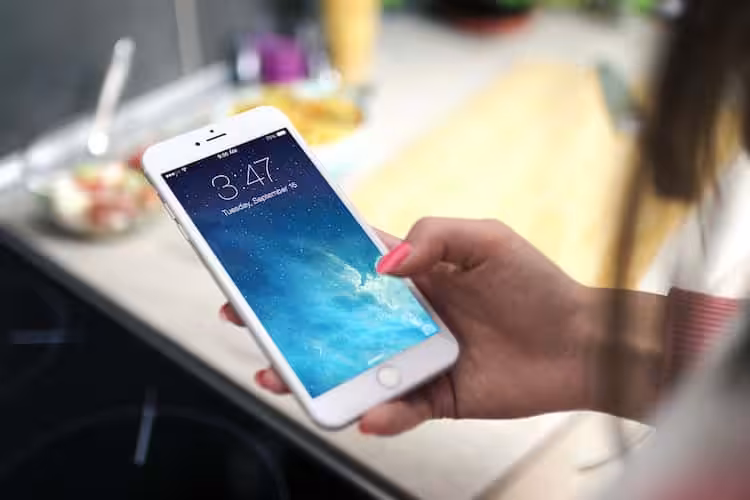 Customer using a smartphone to view business photos and reviews