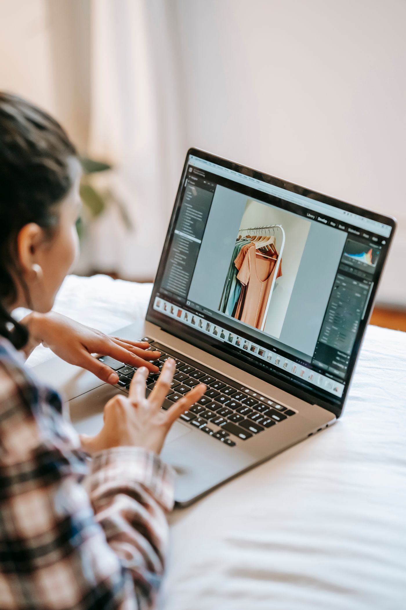 Photo of a Woman Using a Laptop