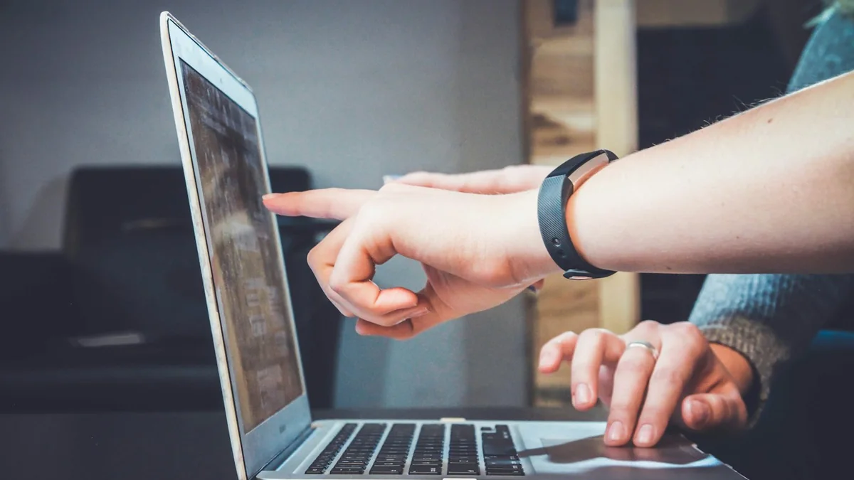 People working together with a laptop