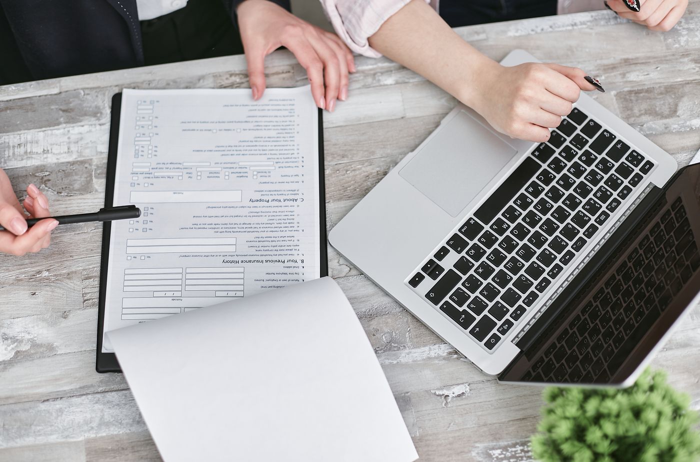 Documents and a Laptop on a Table