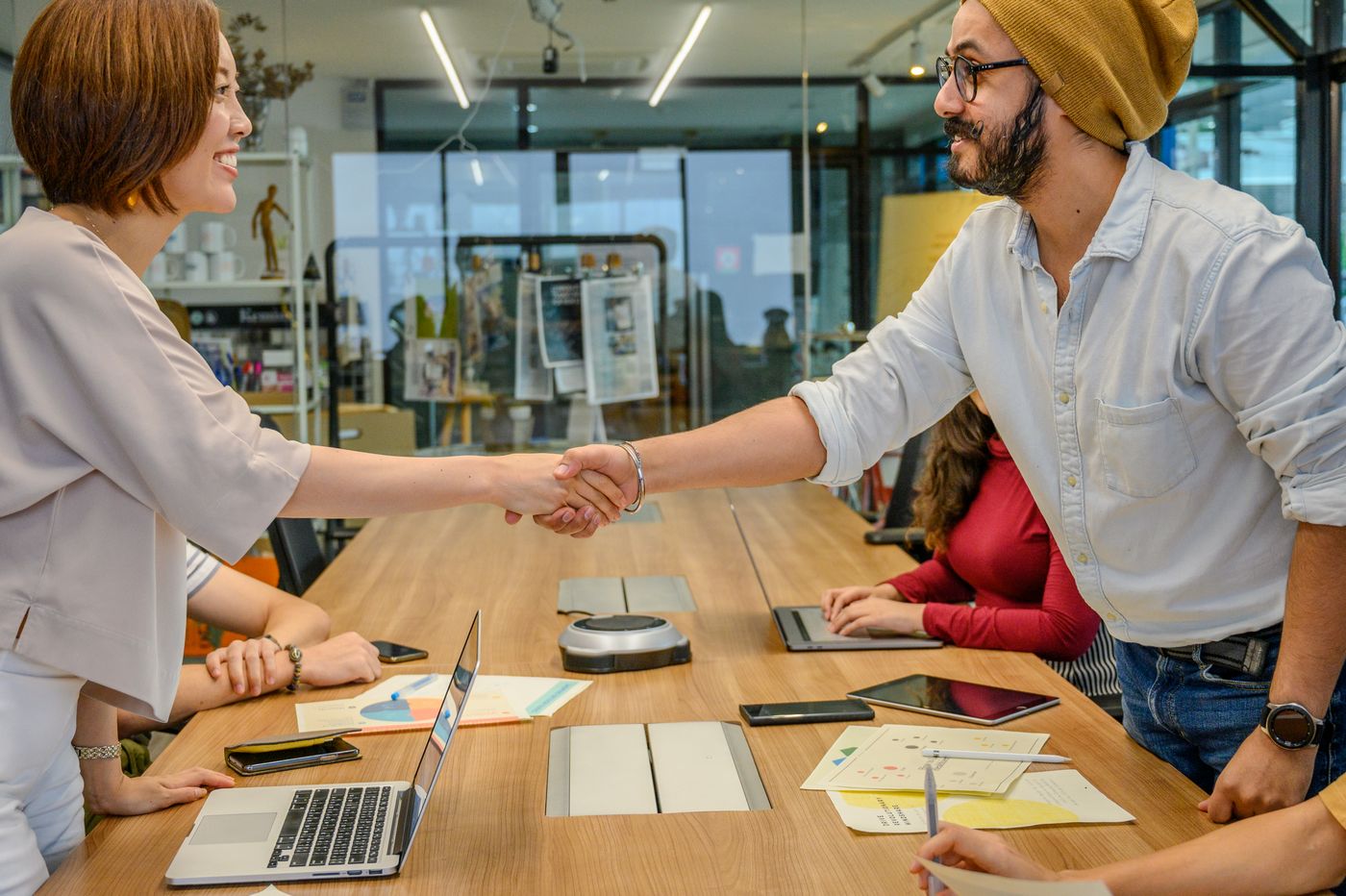 People at Business Meeting Shaking HandsÂ