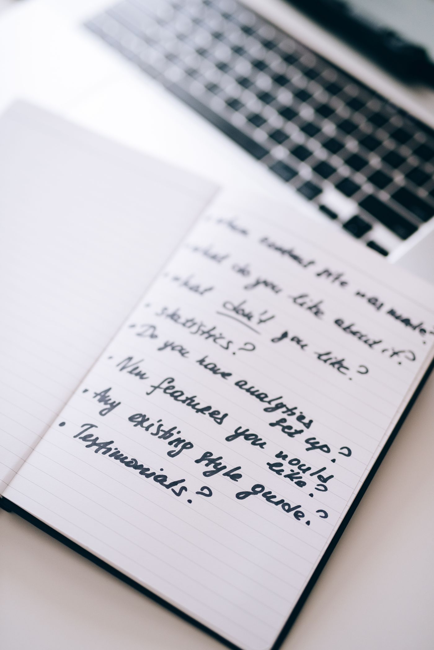 Close-up Shot of an Open Notebook with Notes