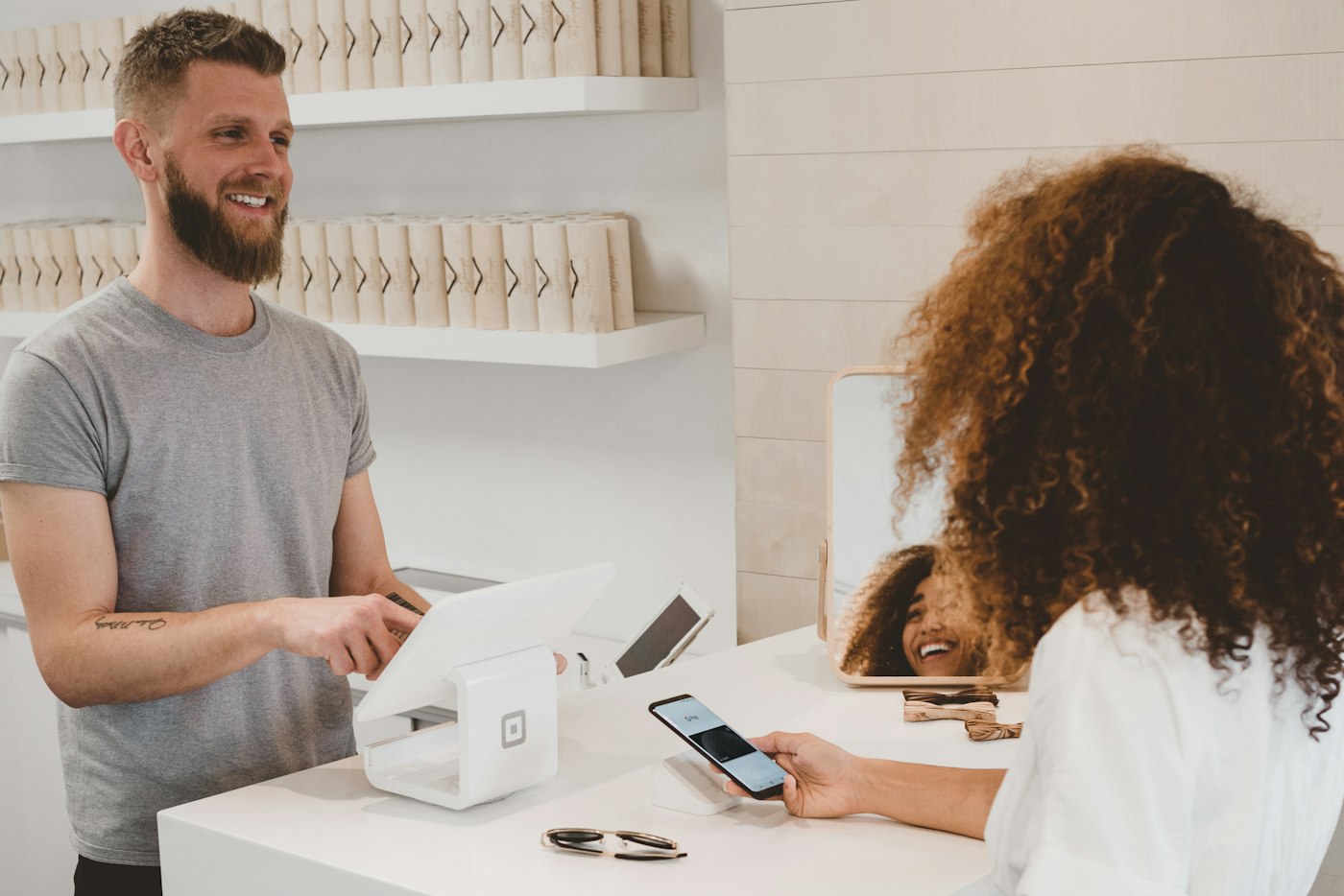 Retail business owner assisting a customer
